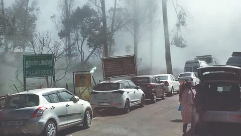 Vehicles line up on way to Pillar Rocks in foggy climate as tourists throng Kodaikanal on Sunday