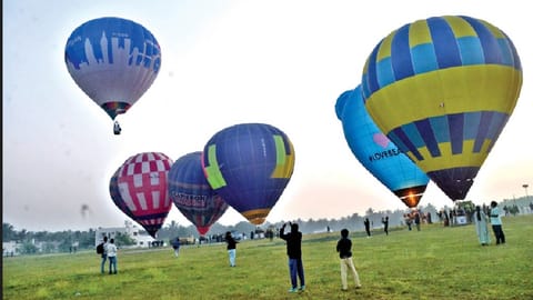 Hot-air balloons taking to skies in Pollachi on Friday.