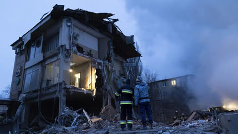 Smoke rises as Donetsk's emergency employees work at a site