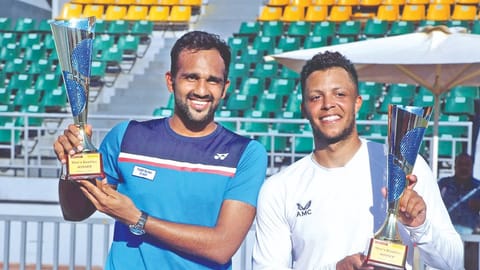 Arjun Kadhe (left) and Jay Clarke pose with the Chennai Open Challenger doubles trophies