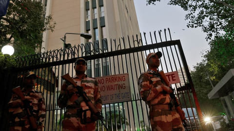 Members of the Indo-Tibetan Border Police (ITBP) stand guard outside a building housing BBC offices