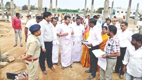 Minister V Senthilbalaji inspecting the bus stand works in Karur on Tuesday