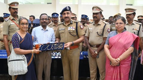 Avadi police commissioner Sandeep Rai Rathore handing over recovered stolen articles to a rightful owner on Tuesday
