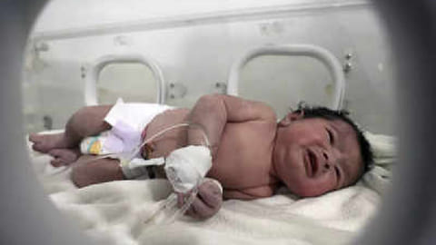 A baby girl who was born under the rubble caused by an earthquake that hit Syria and Turkey receives treatment inside an incubator at a children's hospital in the town of Afrin, Aleppo province, Syria, Tuesday.