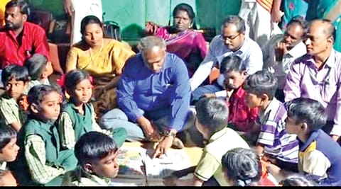 Tirupattur Collector D Baskara Pandian interacting
with children, residents at Mandarakuttai hamlet