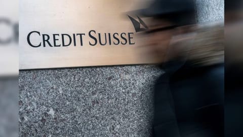A man walks near Credit Suisse bank headquarters in New York City