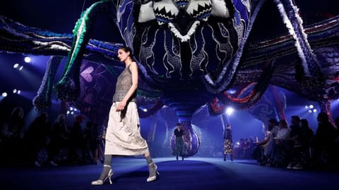 Models present creations by designer Maria Grazia Chiuri