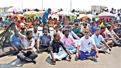 Hundreds of fisherfolk tied black flags on their boats and staged a protest