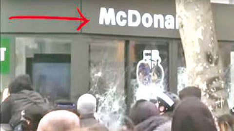 Protesters smash shopfronts in Central Paris over pension reforms