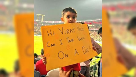 Viral photo to young boy holding placard