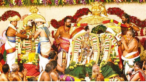 Priests tying the thali during Tirukkalyanam in Madurai on Tuesday