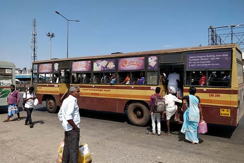 Commuters wait under the sun