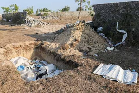 Plastic waste dumped in an open pit (Photo: Justin George)