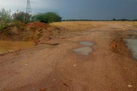 One of the roads that has been laid blocking a water channel, near Ottapidaram in Thoothukudi district