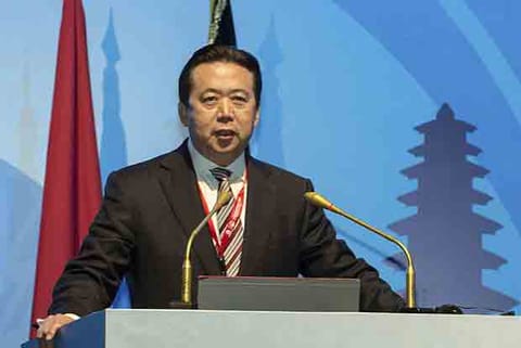China accuses former Interpol chief of bribery