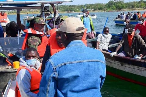 Rescuers search to retrieve bodies after a ferry overturned off on Lake Victoria, Tanzania