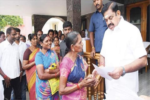 CM receiving petitions from the residents at the camp office in Salem on Friday