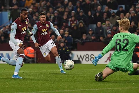 Aston Villa?s Jonathan Kodjia (left) scores his team?s third goal against Liverpool