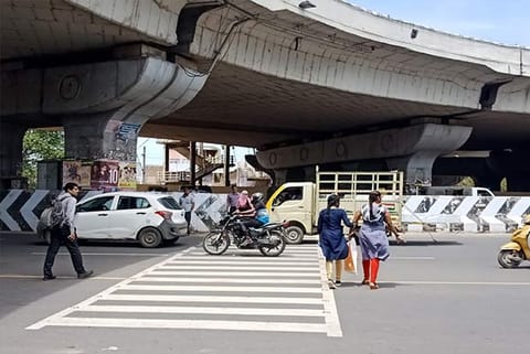 With free movement of vehicles and absence of traffic police, pedestrians at Jawaharlal Nehru Salai find it