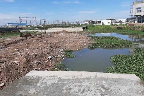 Construction materials disposed block the flow of water
