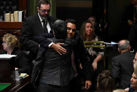 Independent MP Alex Greenwich is hugged by NSW Greens MP Jenny Leong. File: Reuters