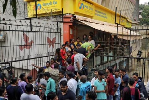No funds available: Depositors at India's PMC Bank survive on loans, charity