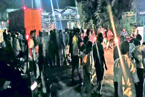Police, residents gather after a bomb blasted