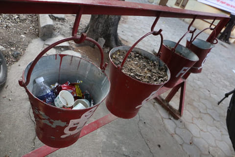 Sand buckets with garbage at Collector?s office