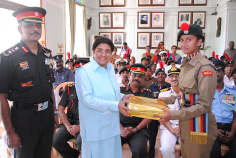 Lt Governor Kiran Bedi presenting mementos to NCC cadets in a reception hosted at Raj Nivas in Puducherry
