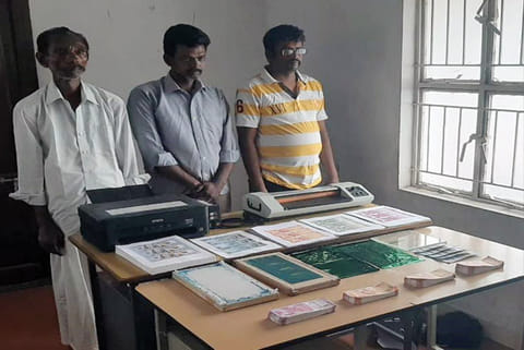 The trio with the xerox machine and the fake currency notes