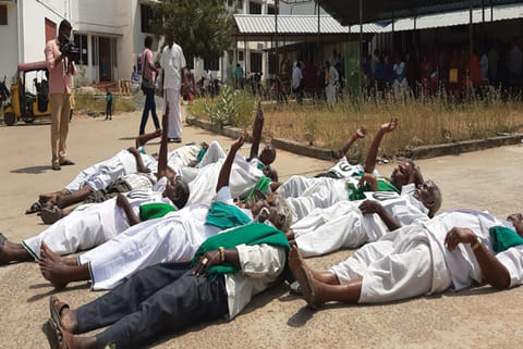 Farmers rolling on the floor of the Tiruchy Collectorate premises as a show of protest on Monday