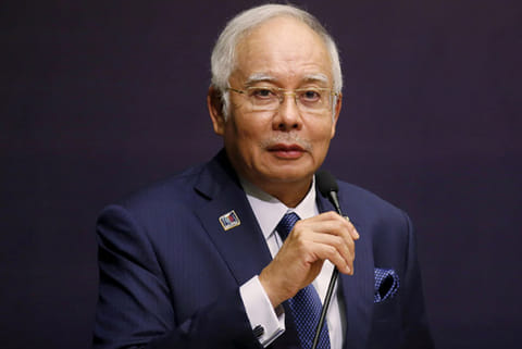 Ex-Malay PM found guilty on all 7 counts in 1st corruption trial
