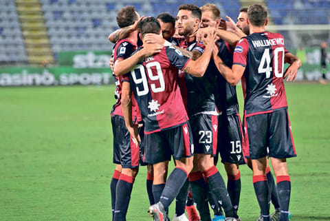 Cagliari players celebrate their success over Juventus