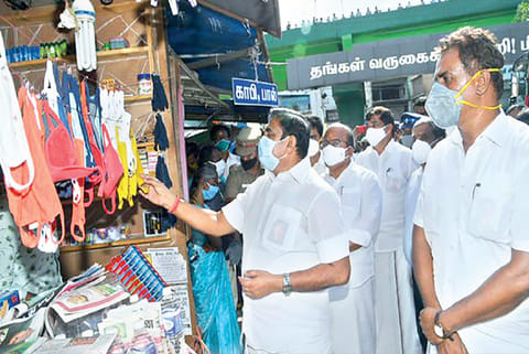 Chief Minister accompanied by Local Administration Minister and officials, inspecting masks