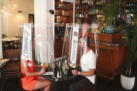 lampshade-like plastic shields to protect diners from the virus
