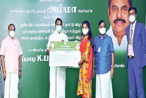Chief Minister handing over welfare assistance to a beneficiary in Kanniyakumari on Tuesday.