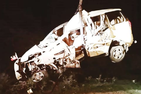 The mangled car being removed near Viralimalai on Wednesday