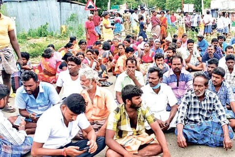 Relatives of the victim and villagers block road at Soolapuram near Peraiyur in Madurai on Wednesday