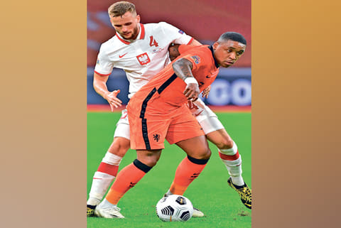 Steven Bergwijn (in front) tries to keep hold of the ball