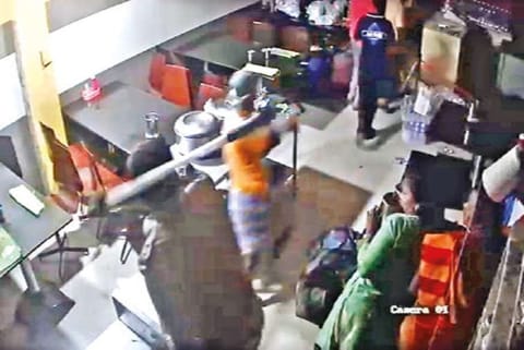 Screengrab of the cop assaulting customers