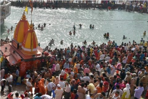 Devotees gather at Har Ki Pauri ghat to offers prayers during Kumbh Mela 2021, in Haridwar