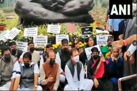 Opposition parties staged a protest  before the statue of Mahatma Gandhi (Photo: ANI)