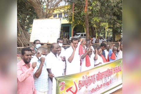 Members of a farmers? association staging a demonstration in Thanjavur on Monday