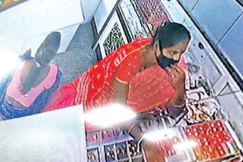 CCTV grab of the women in the pawnshop