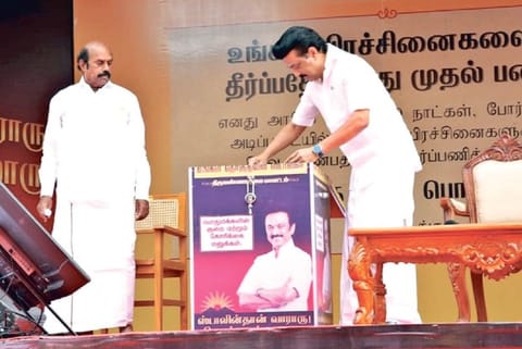 DMK president MK Stalin drops all the petitions into a box on the stage in Tiruvannamalai on Friday.