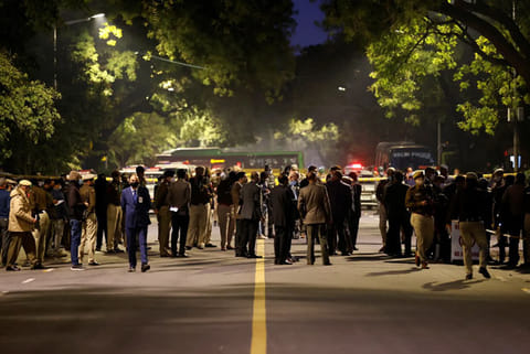 Security officials are seen at the site of an explosion near the Israeli embassy in New Delhi