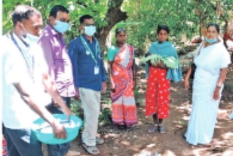 Health officials with the woman and newborn delivered at the sub-centre in Kurumalai on Monday