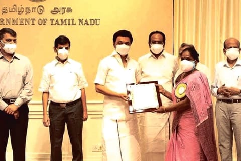 Chief Minister MK Stalin handing over orders of increased monthly assistance of Rs 3,000 to artistes