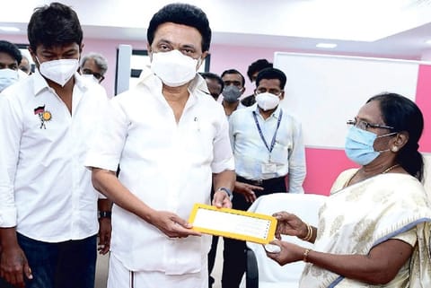 Chief Minister MK Stalin presenting a cheque for Rs 5 lakh to mother of Olympicsbound fencer Bhavani