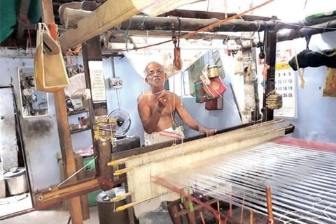 An elderly weaver seen weaving a ?Chediputta? sari at his house in Vellanguli village in Tirunelveli